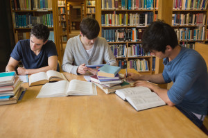 Students doing assignments in college library