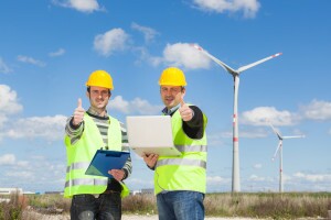 Technician Engineers Thumbs Up with Wind Power Generator